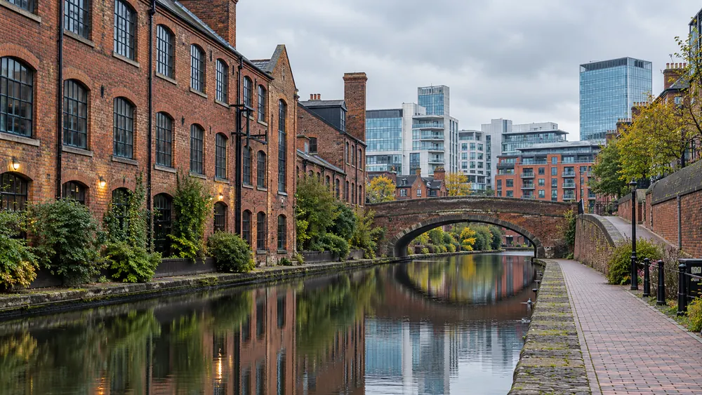 Red brick canal-side buildings and modern commercial architecture